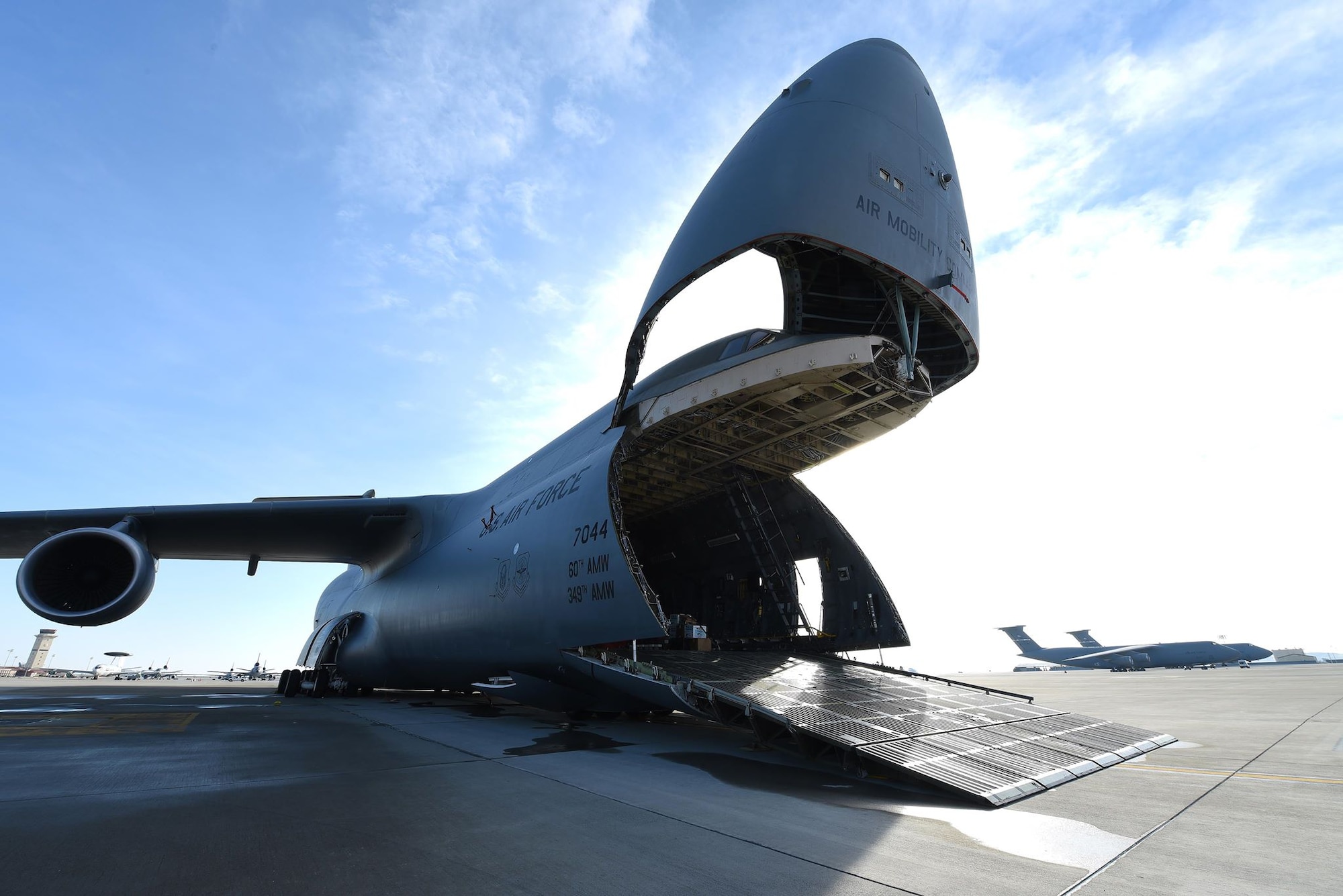 A U.S. Air Force C-5M Super Galaxy aircraft is prepared to load four U.S. Army UH-60 Black Hawk helicopters as a part of a training mission Jan. 13, 2019, at Travis Air Force Base, California. The C-5M is not the normal transport for the Black Hawks, but was offered as transport to the Army in the interest of full-spectrum readiness training for Travis’ C-5M personnel. (U.S. Air Force photo by Airman 1st Class Christian Conrad)