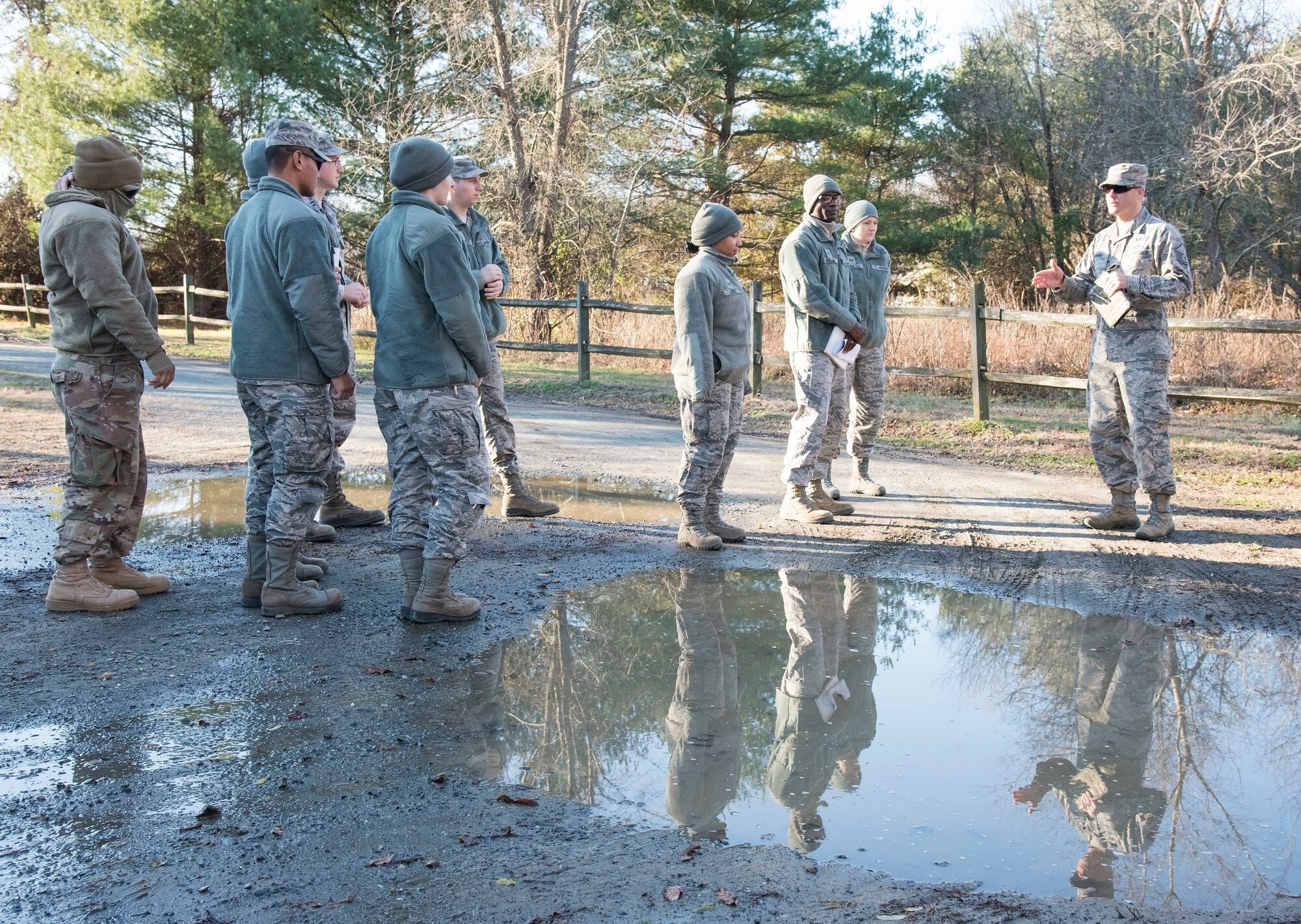 Master Sgt. Jason McNabb, 436th Civil Engineer Squadron engineering flight superintendent, briefs engineering assistants prior to an aircraft mishap survey exercise Dec. 18, 2018, near Killens Pond State Park, Kent County, Del. McNabb briefed the EA survey team of a simulated T-38 Talon aircraft mishap. (U.S. Air Force photo by Roland Balik)