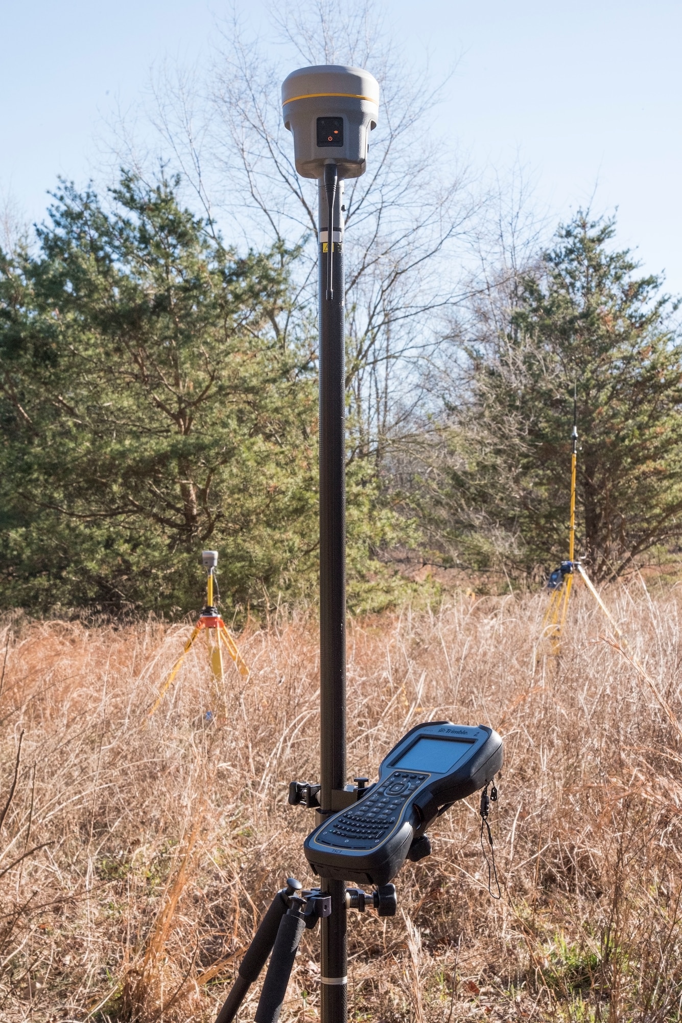 Operational surveying equipment used in a T-38 Talon aircraft mishap survey exercise sits in a field Dec. 18, 2018, near Killens Pond State Park, Kent County, Del. Numerous 436th CES engineering assistants practiced plotting and documenting miscellaneous aircraft and aircrew items using the GPS-enhanced surveying equipment and a digital camera. (U.S. Air Force photo by Roland Balik)