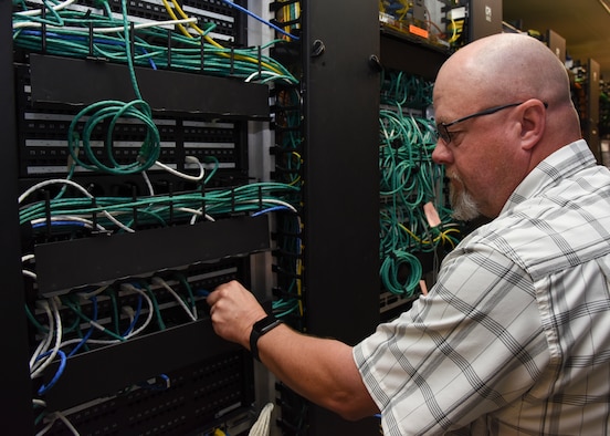 Gilbert Wheeler, 47th Medical Support Squadron information systems flight chief, arranges wires in the communications closet at the Laughlin Air Force Base, Texas medical clinic, Jan. 14, 2019. Wheeler stays busy at the 47th Medical Group, ensuring hundreds of thousands of dollars’ worth of equipment remains up-to-date and available to help Laughlin medics care for patients. (U.S. Air Force photo by Airman 1st Class Anne McCready)