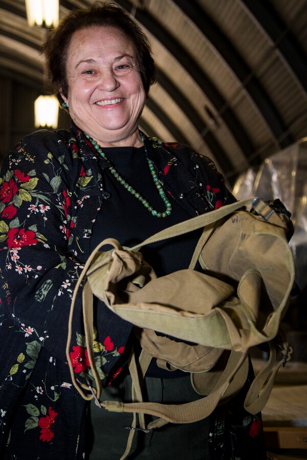 Faye Jonason, director, Marine Corps Base (MCB) Camp Pendleton History Museum Branch, holds a field pack belonging to U.S. Marine William T. Coady during a collection transfer at warehouse 2288, MCB Camp Pendleton, California, Jan. 10, 2019. Several Marine Corps artifacts were collected from the MCB Camp Pendleton History Museum Branch for transport to the National Museum of the Marine Corps in Triangle, Virginia.  (U.S. Marine Corps photo by Cpl. Juan C. Bustos)