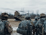 Soldiers assigned to Charlie Troop, 2nd Squadron, 101st Cavalry Regiment, New York Army National Guard from Buffalo, await to hot-load onto a CH-47 Chinook from Bravo Company, 3rd Battalion, 126th Aviation Regiment, NYARNG from Rochester, at the National Guard training site in Youngstown, N.Y., Jan. 12, 2019.