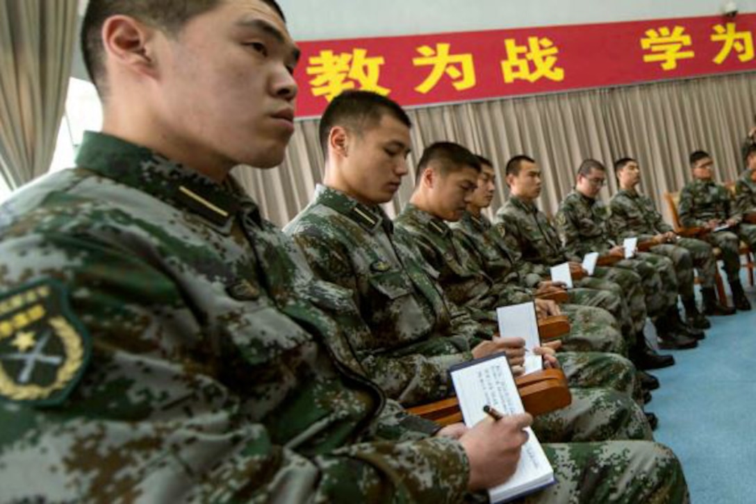 Chinese soldiers in a seminar setting