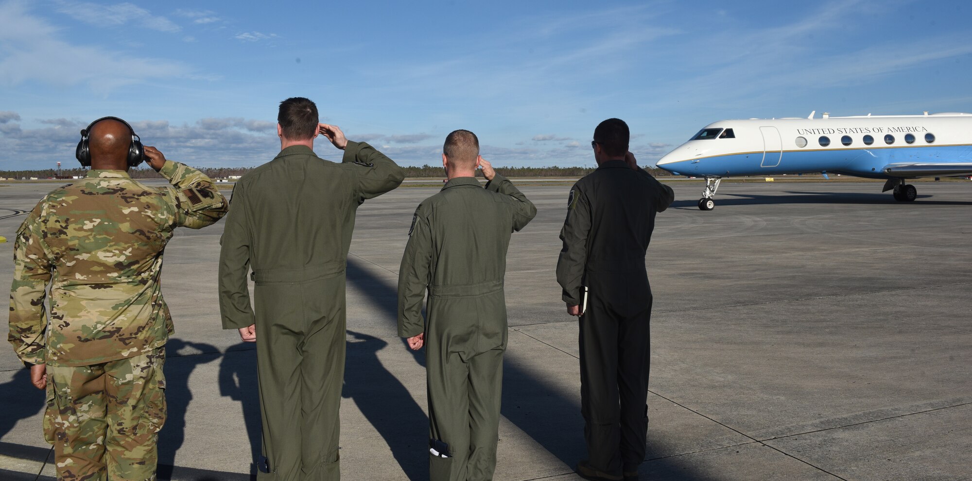 U.S. Air Force officials salute DV aircraft