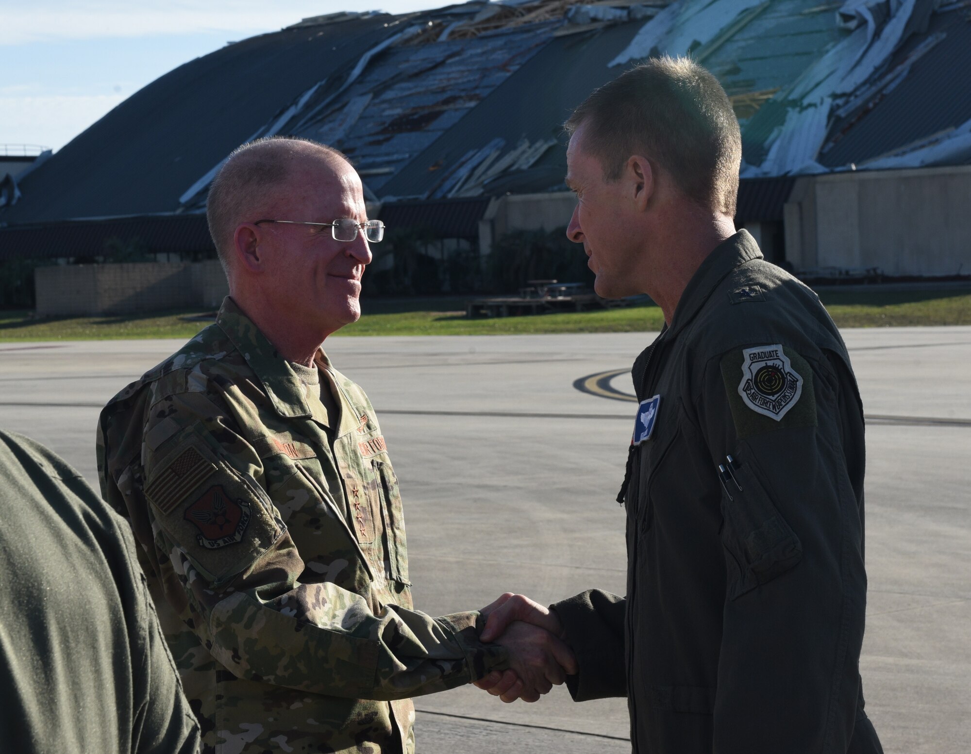 U.S. Air Force officials shake hands