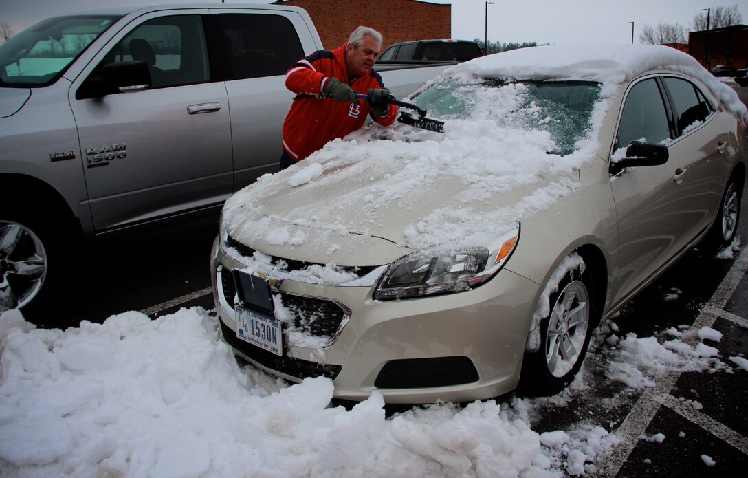 Mr. Ron Peterson, 932nd Mission Support Group, removes snow and ice from a wing staff car at the 932nd Airlift Wing Headquarters on Jan. 14, 2019, Scott Air Force Base, Illinois.  Peterson also put down pre-snow treatments on the sidewalks around the unit as the storm started coming in the Friday prior to the 12-13 January weekend.  The area received a heavy snowfall and forced the cancellation of the unit's January training assembly.
(U.S. Air Force photo by Lt. Col Stan Paregien)