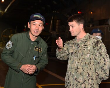 EAST CHINA SEA (Jan. 12, 2019) Flight deck crew members aboard the amphibious assault ship USS Wasp (LHD 1) prepare an MH-60S Sea Hawk helicopter, assigned to the Helicopter Sea Combat Squadron (HSC) 25 "Island Knights” for flight during a cooperative deployment with Japan Maritime Self-Defense Force amphibious transport dock ship JS Kunisaki (LST 4003). Wasp, flagship of Wasp Amphibious Ready Group, is operating in the Indo-Pacific region to enhance interoperability with partners and serve as a ready-response force for any type of contingency.