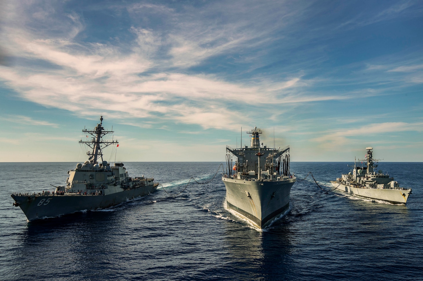 SOUTH CHINA SEA (Jan. 12, 2019) The Arleigh Burke-class guided-missile destroyer USS McCampbell (DDG 85), the Military Sealift Command fleet replenishment oiler USNS Henry J. Kaiser (T-AO 187), and the Royal Navy Type 23 ‘Duke’ Class guided-missile frigate HMS Argyll (F231) transit during a replenishment-at-sea. McCampbell is forward-deployed to the U.S. 7th Fleet area of operations in support of security and stability in the Indo-Pacific region.
