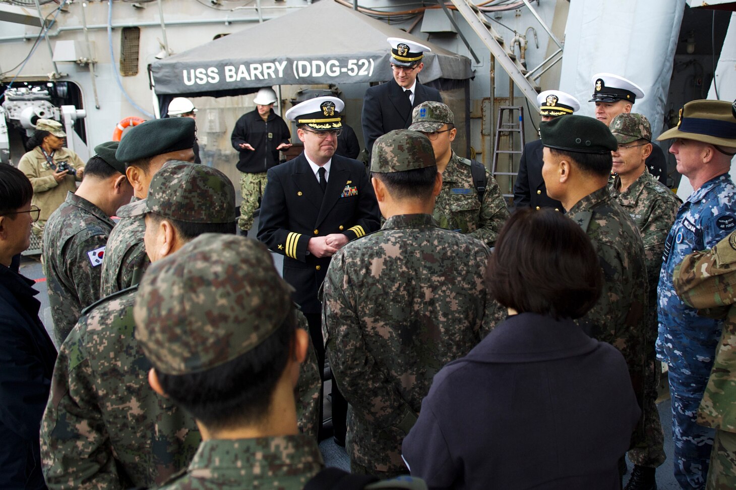 YOKOSUKA, Japan (Jan. 15, 2019) Cmdr. William C. Blodgett, the commanding officer of the Arleigh Burke-class guided-missile destroyer USS Barry (DDG 52), welcomes aboard Republic of Korea and Australia military officials aboard Barry for a ship tour. Barry is forward-deployed to the U.S. 7th Fleet area of operations in support of security and stability in the Indo-Pacific region.