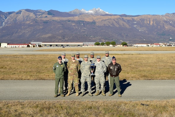 Airmen from the 31st Fighter Wing Safety Office pose with the United States Air Force Europe-Africa Commanders Trophy.