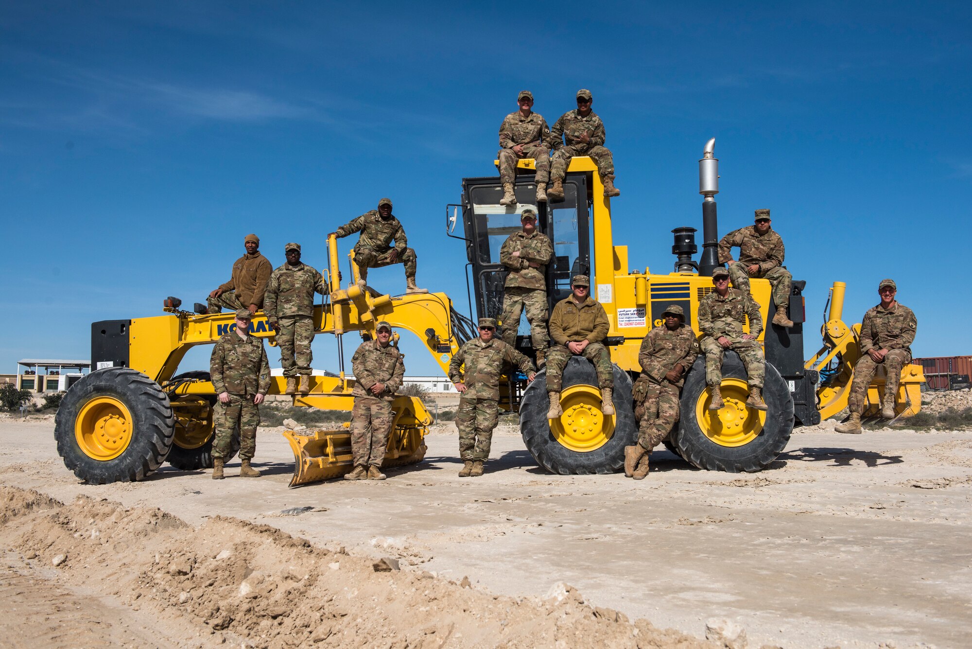 Airmen from the 386th Expeditionary Civil Engineer Squadron pose for a photo at an undisclosed location in Southwest Asia, Jan. 10, 2019. Airmen from this rotation have continued the work from the last rotation and have connected the road to its endpoint.