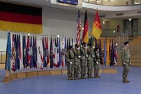 U.S. Army Col. Seth Knazovich, commander of the 41st Field Artillery Brigade, takes command of the color guard during the unit activation ceremony in Grafenwoehr, Germany, Nov. 30, 2018.