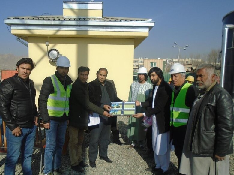 Showing all the keys they received upon the turnover of the Police Town Water Tank Replacement project are members from the Ministry of Interior along with the contractor representatives and USACE LNQAs.
