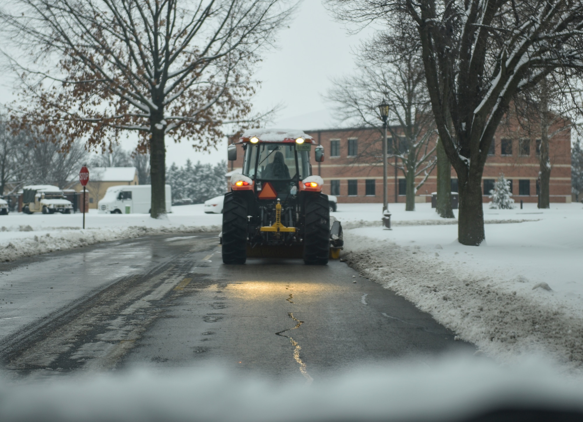 Members of the 375th Civil Engineer squadron spent the morning of Jan. 12, 2019, clearing roads at Scott Air Force Base, Illinois, after heavy snowfall. Each shift required about 20 people to aid in the process of clearing the roads to ensure motorists are safe.