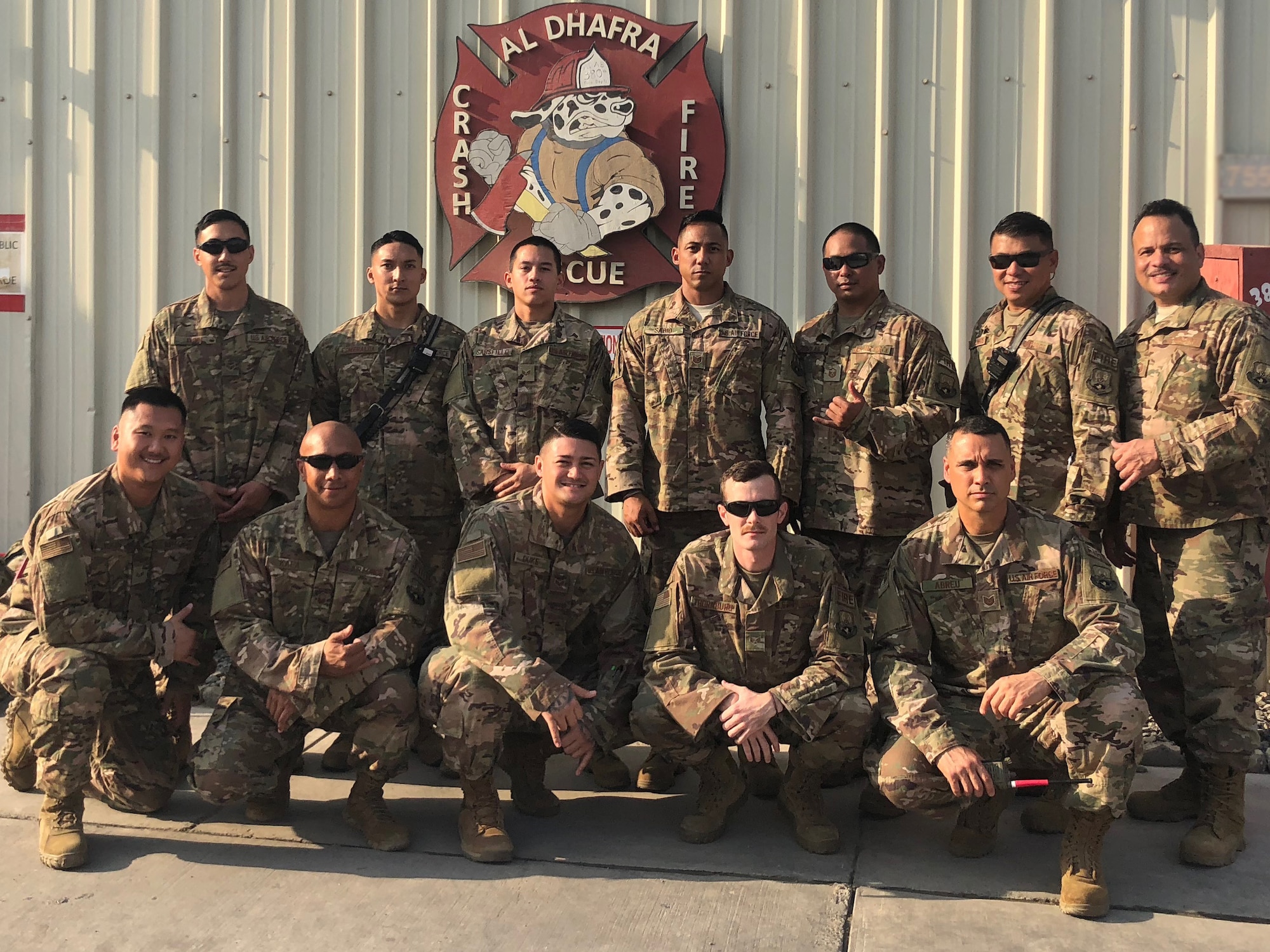 The 380th Expeditionary Civil Engineer Squadron firefighters take a group photo Dec. 24, 2018 at Al Dhafra Air Base, United Arab Emirates.