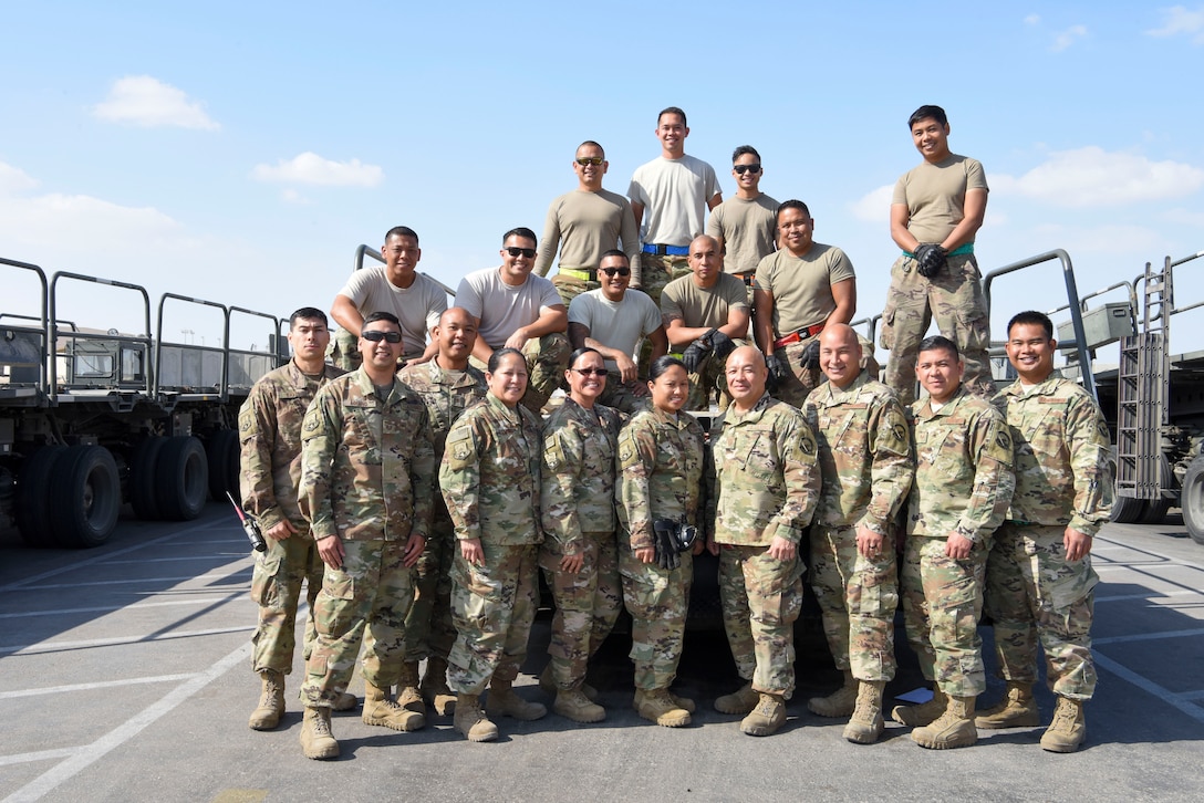 The 380th Expeditionary Logistics Readiness Squadron Air Terminal Operations Center Reservists from the 44th Aerial Port Squadron take a group photo Dec. 24, 2018 at Al Dhafra Air Base, United Arab Emirates.