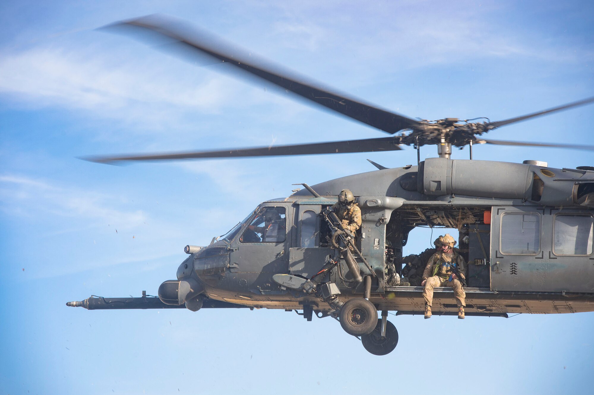 Members from the 38th and 41st Rescue Squadrons glance over a mock battlefield during pre-deployment ‘spin-up’ training, Dec. 12, 2018, at Avon Park Air Force Range, Fla. During this pre-deployment ‘spin-up’ training, Moody’s 347th Rescue Group tested and maximized their combat search and rescue (CSAR) and personnel recovery capabilities. Under normal circumstances, the HH-60G Pave Hawk helicopter crews and maintainers deploy from Moody and integrate with Guardian Angel teams from different bases. This time, Moody’s 38th RQS and 41st RQS’s will deploy together and utilized this exercise to improve their mission readiness and cohesion before their departure. (U.S. Air Force photo by Senior Airman Greg Nash)