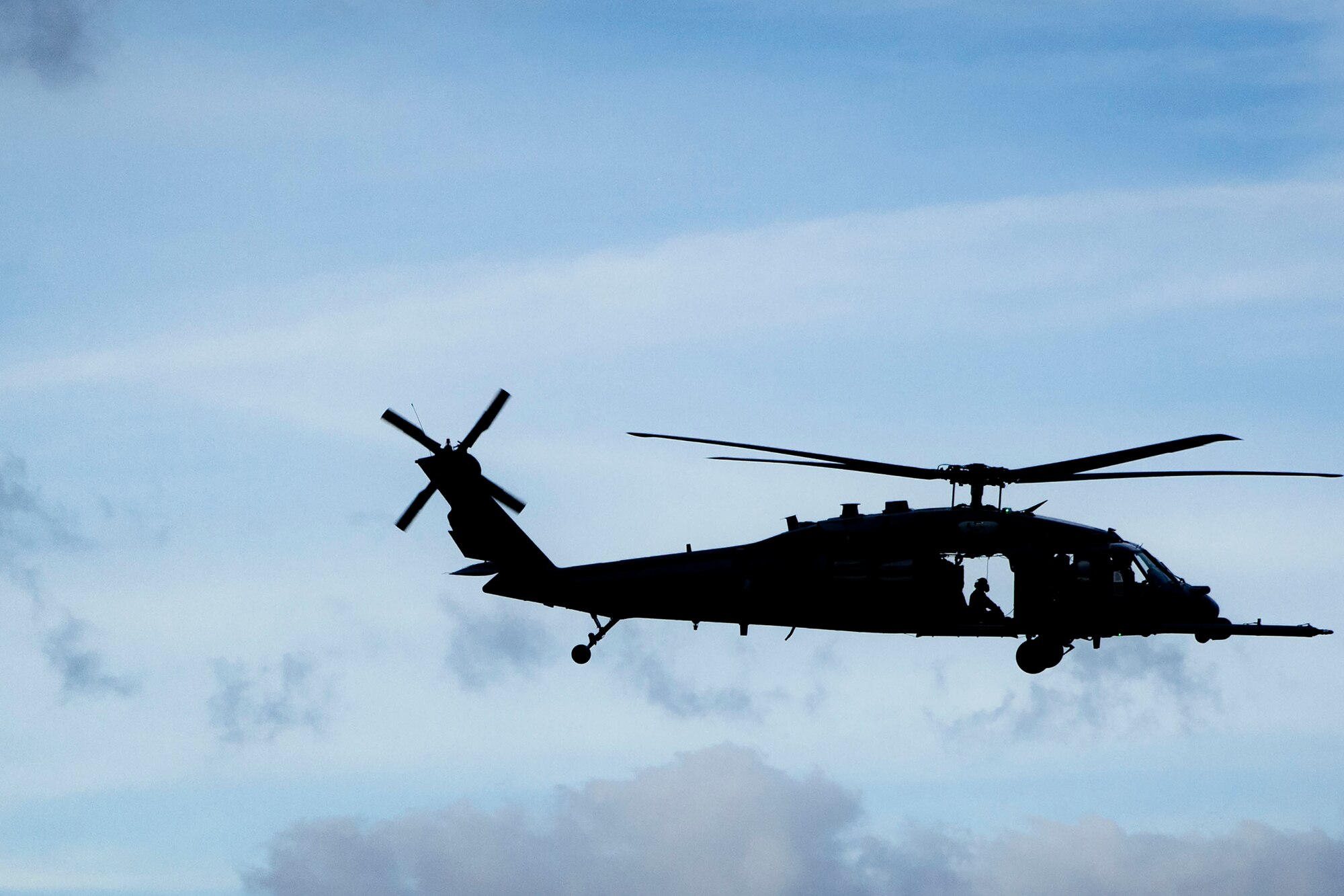 A 347th Rescue Group Airman overlooks a mock battlefield in an HH-60G Pave Hawk during pre-deployment ‘spin-up’ training, Dec. 12, 2018, at Avon Park Air Force Range, Fla. During this pre-deployment ‘spin-up’ training, Moody’s 347th Rescue Group tested and maximized their combat search and rescue (CSAR) and personnel recovery capabilities. Under normal circumstances, the HH-60G Pave Hawk helicopter crews and maintainers deploy from Moody and integrate with Guardian Angel teams from different bases. This time, Moody’s 38th RQS and 41st RQS’s will deploy together and utilized this exercise to improve their mission readiness and cohesion before their departure. (U.S. Air Force photo by Senior Airman Greg Nash)