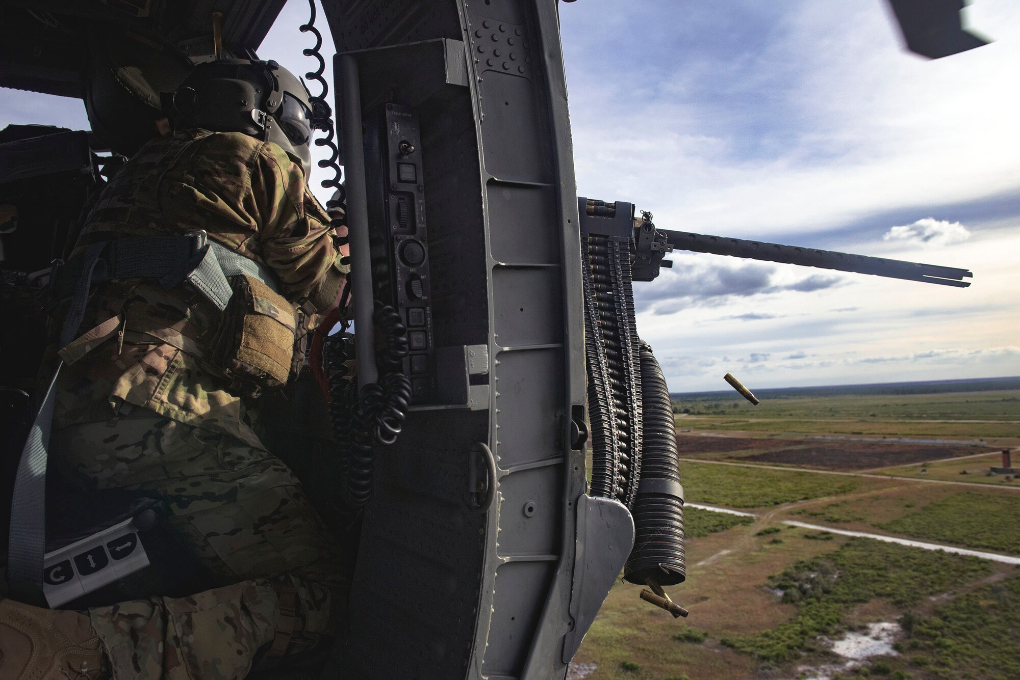 A 41st Rescue Squadron (RQS) special missions aviator fires an M2 machine gun from an HH-60G Pave Hawk during pre-deployment ‘spin-up’ training, Dec. 12, 2018, at Avon Park Air Force Range, Fla. During this pre-deployment ‘spin-up’ training, Moody’s 347th Rescue Group tested and maximized their combat search and rescue (CSAR) and personnel recovery capabilities. Under normal circumstances, the HH-60G Pave Hawk helicopter crews and maintainers deploy from Moody and integrate with Guardian Angel teams from different bases. This time, Moody’s 38th RQS and 41st RQS’s will deploy together and utilized this exercise to improve their mission readiness and cohesion before their departure. (U.S. Air Force photo by Senior Airman Greg Nash)