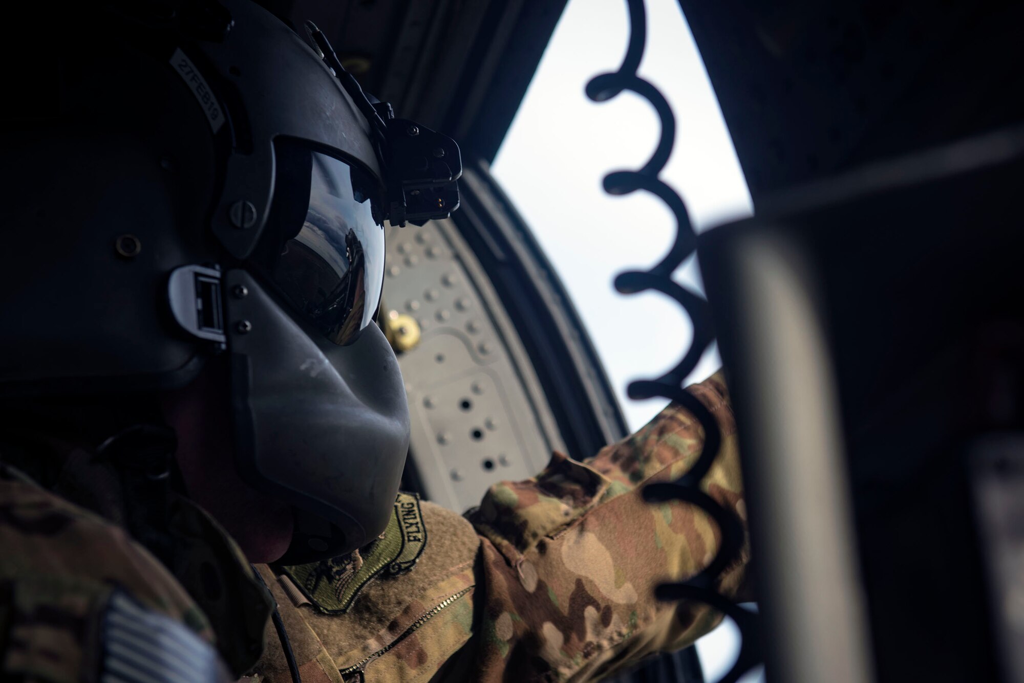 A 41st Rescue Squadron (RQS) special missions aviator scans a mock battlefield from an HH-60G Pave Hawk during pre-deployment ‘spin-up’ training, Dec. 12, 2018, at Avon Park Air Force Range, Fla. During this pre-deployment ‘spin-up’ training, Moody’s 347th Rescue Group tested and maximized their combat search and rescue (CSAR) and personnel recovery capabilities. Under normal circumstances, the HH-60G Pave Hawk helicopter crews and maintainers deploy from Moody and integrate with Guardian Angel teams from different bases. This time, Moody’s 38th RQS and 41st RQS’s will deploy together and utilized this exercise to improve their mission readiness and cohesion before their departure. (U.S. Air Force photo by Senior Airman Greg Nash)