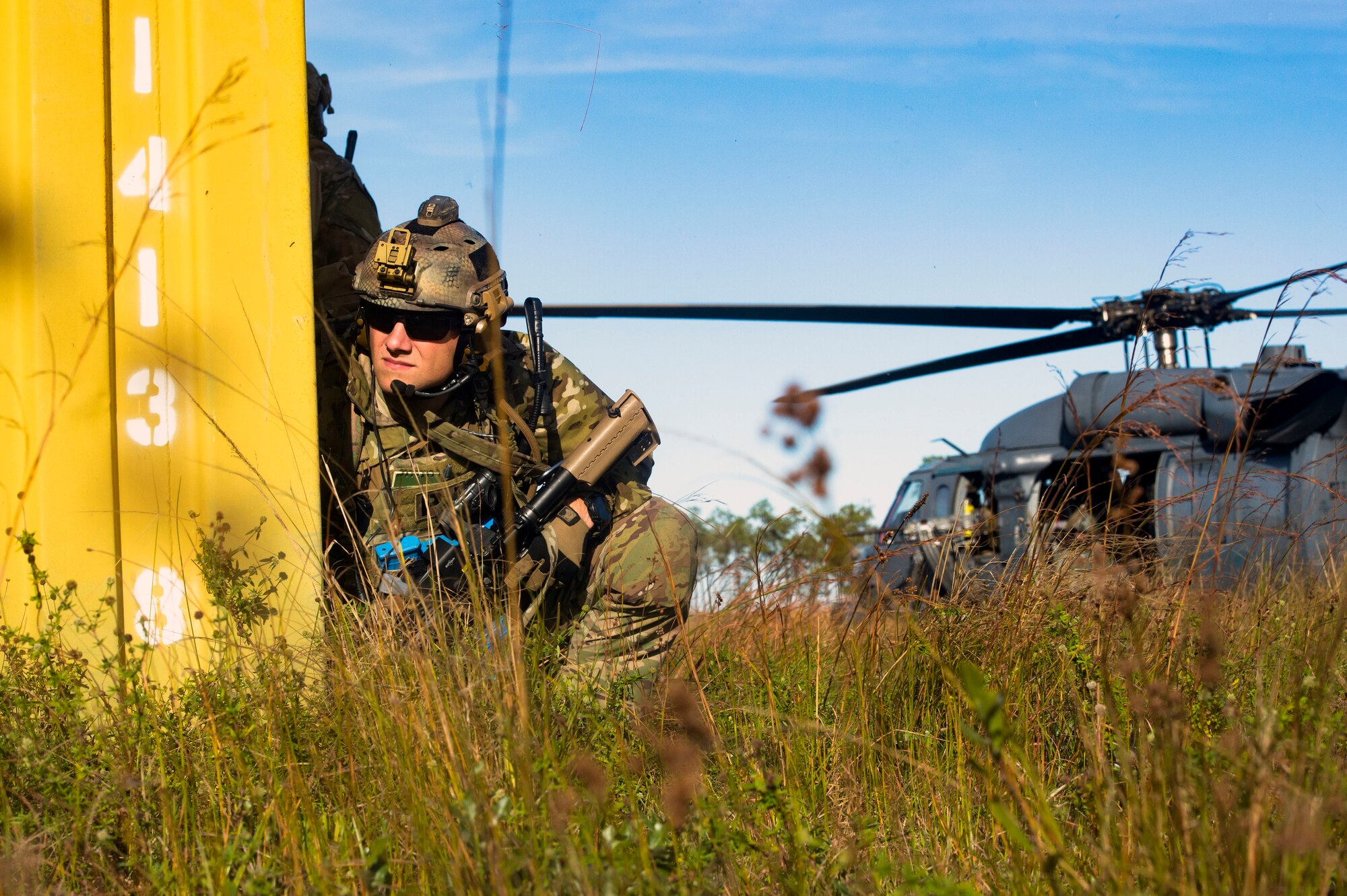 A pararescueman from the 38th Rescue Squadron (RQS) scans a mock battlefield during pre-deployment 'spin-up' training, Dec. 12, 2018, at Avon Park Air Force Range, Fla. During this pre-deployment ‘spin-up’ training, Moody’s 347th Rescue Group tested and maximized their combat search and rescue (CSAR) and personnel recovery capabilities. Under normal circumstances, the HH-60G Pave Hawk helicopter crews and maintainers deploy from Moody and integrate with Guardian Angel teams from different bases. This time, Moody’s 38th RQS and 41st RQS’s will deploy together and utilized this exercise to improve their mission readiness and cohesion before their departure. (U.S. Air Force photo by Senior Airman Greg Nash)