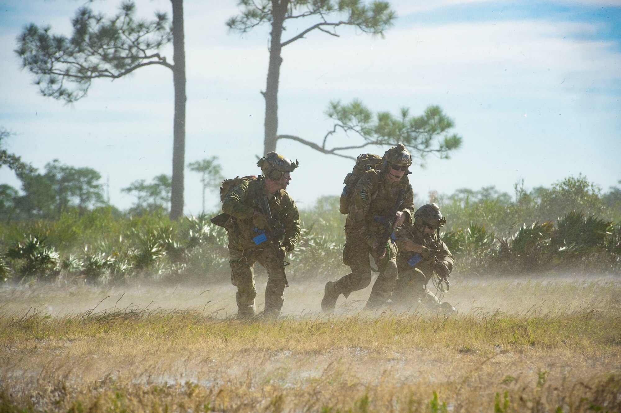 Pararescuemen from the 38th Rescue Squadron (RQS) advance a mock battlefield to rescue personnel during pre-deployment ‘spin-up’ training, Dec. 12, 2018, at Avon Park Air Force Range, Fla. During this pre-deployment ‘spin-up’ training, Moody’s 347th Rescue Group tested and maximized their combat search and rescue (CSAR) and personnel recovery capabilities. Under normal circumstances, the HH-60G Pave Hawk helicopter crews and maintainers deploy from Moody and integrate with Guardian Angel teams from different bases. This time, Moody’s 38th RQS and 41st RQS’s will deploy together and utilized this exercise to improve their mission readiness and cohesion before their departure. (U.S. Air Force photo by Senior Airman Greg Nash)
