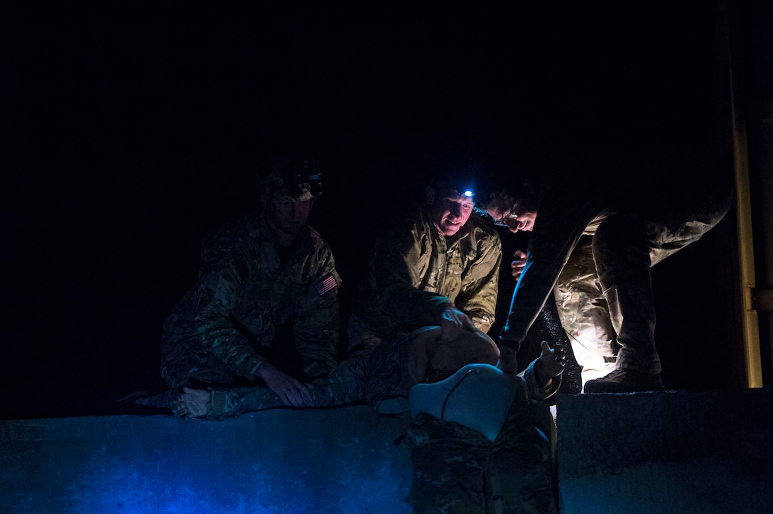 347th Rescue Group (RQG) personnel lift a simulated mannequin patient during a personnel recovery scenario as part of pre-deployment ‘spin-up’ training, Dec. 15, 2018, at Avon Park Air Force Range, Fla. During this pre-deployment ‘spin-up’ training, Moody’s 347th Rescue Group tested and maximized their combat search and rescue (CSAR) and personnel recovery capabilities. Under normal circumstances, the HH-60G Pave Hawk helicopter crews and maintainers deploy from Moody and integrate with Guardian Angel teams from different bases. This time, Moody’s 38th RQS and 41st RQS’s will deploy together and utilized this exercise to improve their mission readiness and cohesion before their departure. (U.S. Air Force photo by Senior Airman Greg Nash)