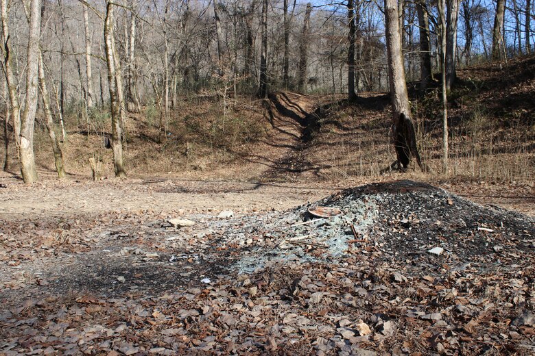 Soil erosion along a path of an off-road vehicle can be seen Jan. 11, 2019 in the background of an illegal trash and fire site at Cane Hollow at Center Hill Lake.  (USACE photo by Ashley Webster)