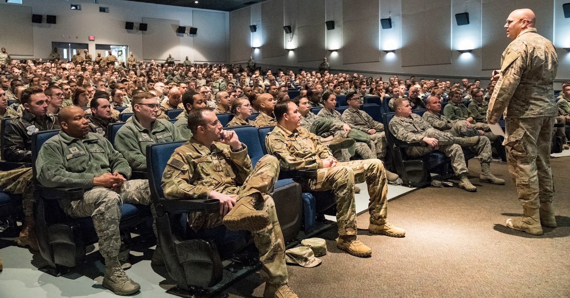 Chief Master Sgt. Anthony Green, 436th Airlift Wing command chief, speaks to Eagle Wing members during the afternoon session of an Enlisted All Call Jan. 15, 2019, at the Base Theater on Dover Air Force Base, Del. Green hosted two all calls to inform enlisted members on the State of the Base briefing and ending with a question-and-answer session. (U.S. Air Force photo by Roland Balik)
