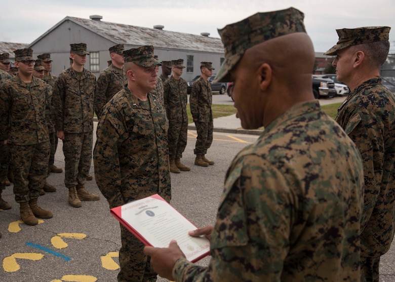 U.S. Marine Corps Sgt. Maj. Cortez L. Brown, sergeant major of 6th Marine Corps District, reads the promotion warrant for Chief Warrant Officer Matthew Kessinger, personnel officer of 6th MCD, during Kessinger's promotion to chief warrant officer five aboard Marine Corps Recruit Depot Parris Island, South Carolina, Dec. 19, 2018. Kessinger, a native of Louisville, Kentucky, has currently served 28 years in the Marine Corps. (U.S. Marine Corps photo by Lance Cpl. Jack A. E. Rigsby)