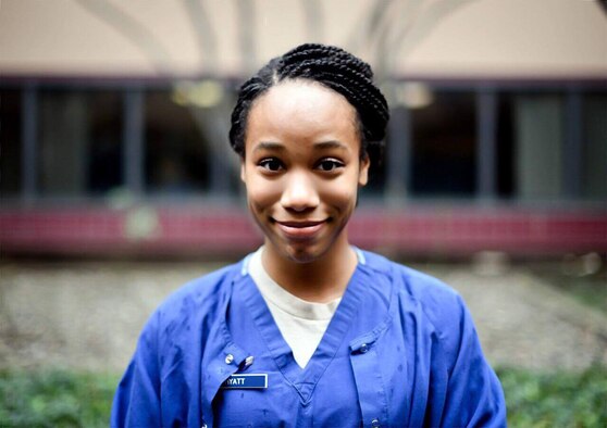 Airman 1st Class SaiAnni Hyatt, 60th Dental Squadron dental assistant, stands in the courtyard of Travis Air Force Base, California's dental clinic January 16. Hyatt has been personally influenced by the teachings of Dr. Martin Luther King, Jr. and uses the ideals of his she has internalized to bring her best self to the U.S. Air Force. (U.S. Air Force photo by Airman 1st Class Christian Cornad)