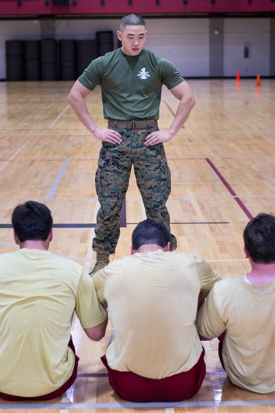 Staff Sgt. Anthony Kim, platoon sergeant with the Marine Forces Reserve Band, oversees members of the Loyola University New Orleans baseball team at Loyola University New Orleans, Jan. 12, 2019. Master Sgt. Bryan Smith, assistant Marine officer instructor for Tulane University and Marines with Marine Forces Reserve led a workout session that was physically and mentally challenging. The workout session was comprised of four events; incentive training, shamrock drill, Marine Corps Martial Arts Program demonstrations and casualty evacuation drills. (U.S. Marine Corps photo by Sgt. Andy O. Martinez)