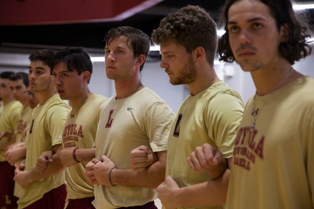 Members of the Loyola University New Orleans baseball team, listen to instructions before a team workout led by Marines from Marine Forces Reserve, at Loyola University New Orleans, Jan. 12, 2019. The Marines provided a workout that was physically challenging to the participants but also focused on teamwork and leadership. The workout session was comprised of four events; incentive training, shamrock drill, Marine Corps Martial Arts Program demonstrations and casualty evacuation drills. (U.S. Marine Corps photo by Cpl. Niles Lee)