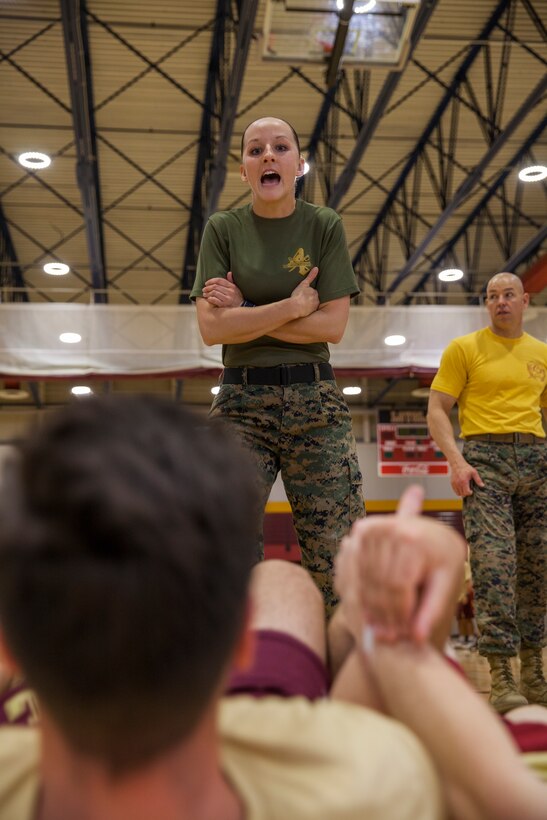 Gunnery Sgt. Kassandra Blade, the logistics systems coordinations chief with Headquarters Battalion, Marine Forces Reserve, encourages a member of the Loyola University New Orleans baseball team during a workout session at Loyola University New Orleans, Jan. 12, 2019. Blade, a former drill instructor, brought her experience to help lead a workout that was physically challenging to the participants but also focused on teamwork and leadership. The workout session was comprised of four events; incentive training, shamrock drill, Marine Corps Martial Arts Program demonstrations and casualty evacuation drills. (U.S. Marine Corps photo by Cpl. Niles Lee)