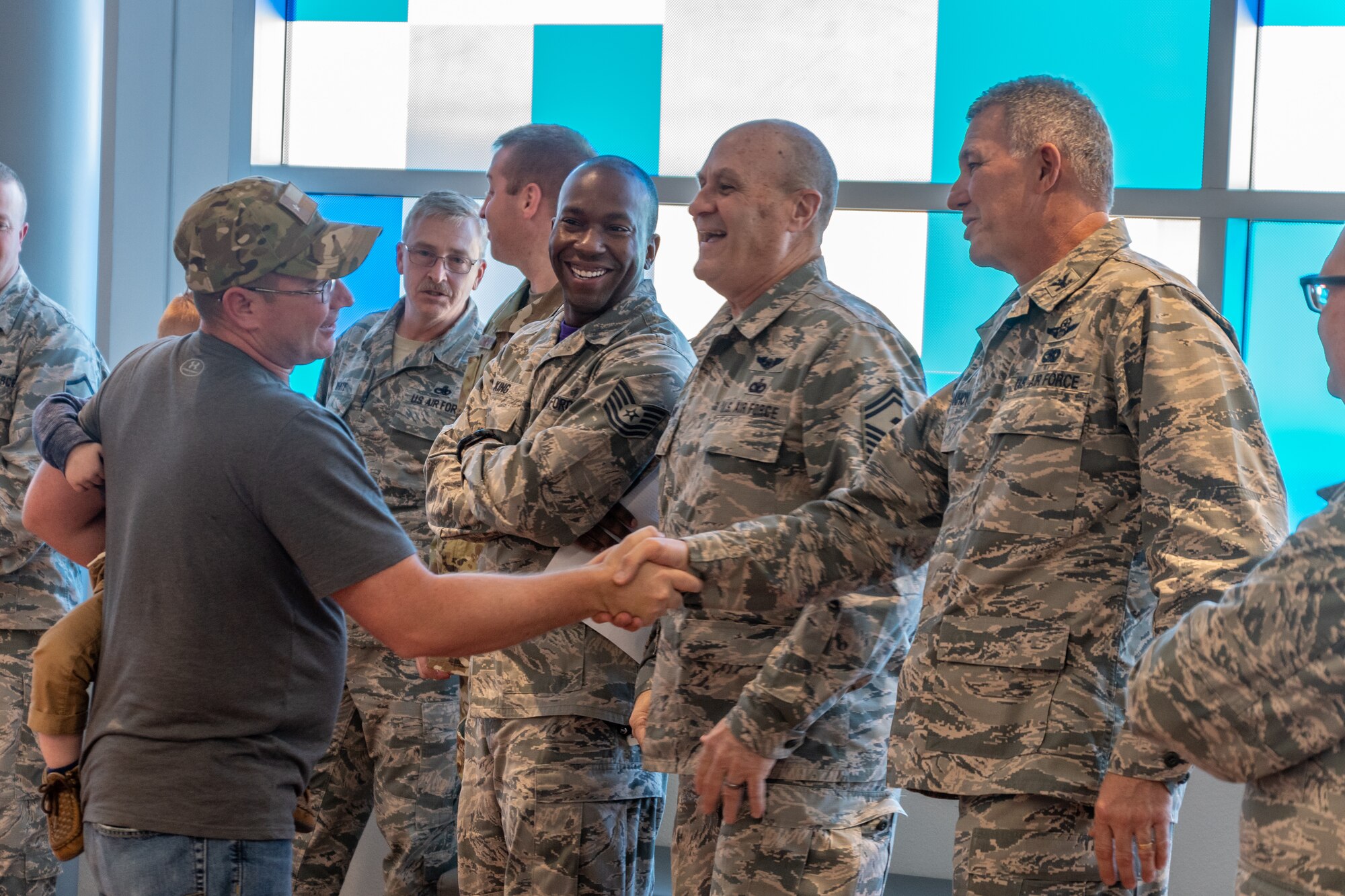 U.S. Air Force Colonel Robert VanHoy, 307th Bomb Wing commander, greets a returning deployer in Shreveport, Louisiana, Jan. 12, 2019.  Reserve Citizen Airmen of the 307th Bomb Wing have been deployed for several months supporting several different operations throughout the world. (U.S. Air Force photo by Tech. Sgt. Cody Burt)