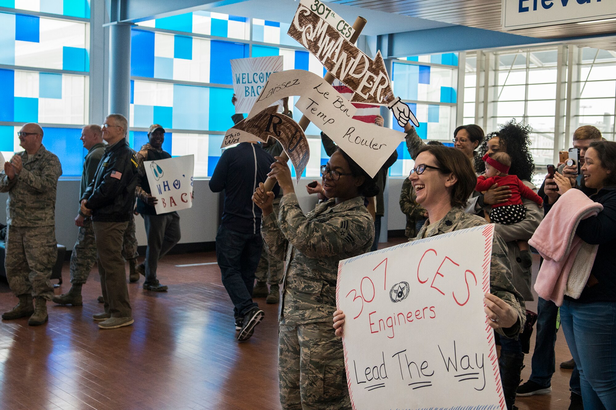 Family and members of the 307th Bomb Wing celebrate the return of their Citizen Airmen from a deployment to Southwest Asia on Jan. 14, 2019, Shreveport, Louisiana. Dozens of Reserve Citizen Airmen were returning to Barksdale Air Force Base after being deployed overseas.(U.S. Air Force photo by Greg Steele/Released)