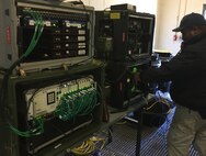 Dequinn McGraw, a member of Joint Task Force Civil Support’s (JTF-CS) communications department, participates in the command’s first tactical satellite (TACSAT) communication exercise (COMMEX) of the new year January 15, 2019 at Felker Army Airfield on Fort Eustis in preparation for exercise Sudden Response 19 (SR19) held on January 24-30. SR19, held at Fort Bragg, NC this year, is a command-led exercise that tests JTF-CS and Defense Chemical, Biological, Radiological and Nuclear (CBRN) Response Force (DCRF) capabilities to response to a catastrophic CBRN event. When directed, JTF-CS is ready to respond in 24 hours to provide command and control of 5,200 federal military forces located at more than 36 locations throughout the nation in support of civil authority response operations to save lives, prevent further injury and provide critical support to enable community recovery. (Official DoD photo by David “Rick” George/released)