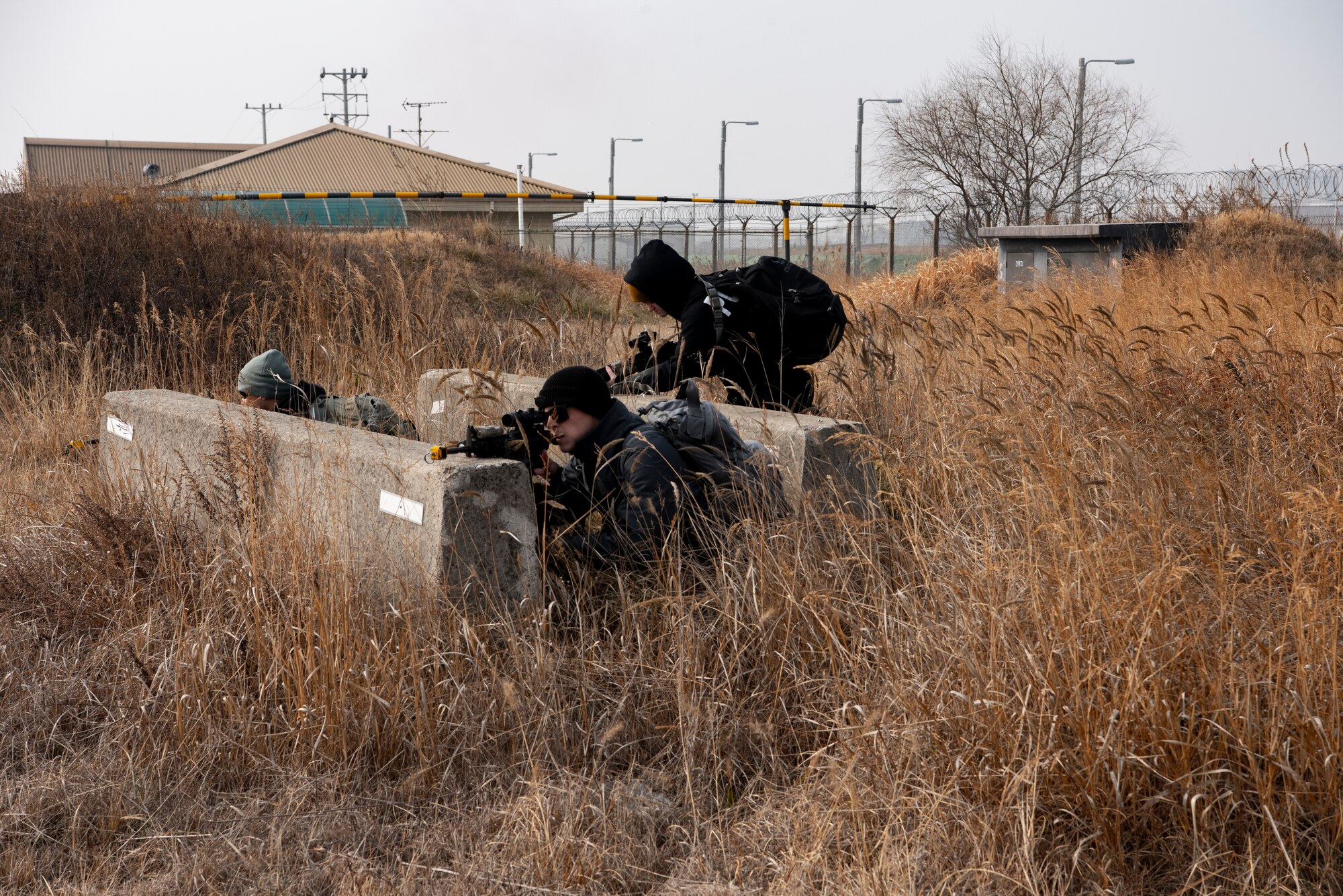 8th Security Forces Squadron Airmen role-play as hostile forces during routine training at Kunsan Air Base, Republic of Korea, Jan. 14, 2019. The 8th Fighter Wing conducts frequent training to maintain the highest level of readiness. (U.S. Air Force photo by Staff Sgt. Levi Rowse/Released)