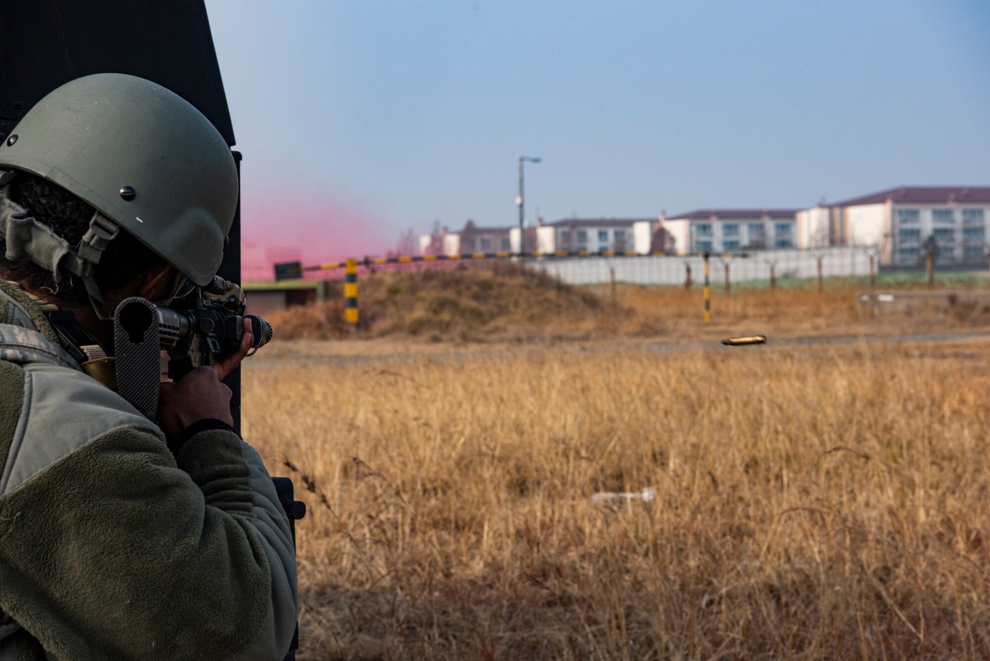 U.S. Air Force Airman 1st Class Sean McCants, 8th Security Forces Squadron member, engages simulated hostile forces during routine training at Kunsan Air Base, Republic of Korea, Jan. 14, 2019. The 8th SFS frequently practices combat skills and tactics to ensure rapid response to contingencies. (U.S. Air Force photo by Staff Sgt. Levi Rowse/Released)