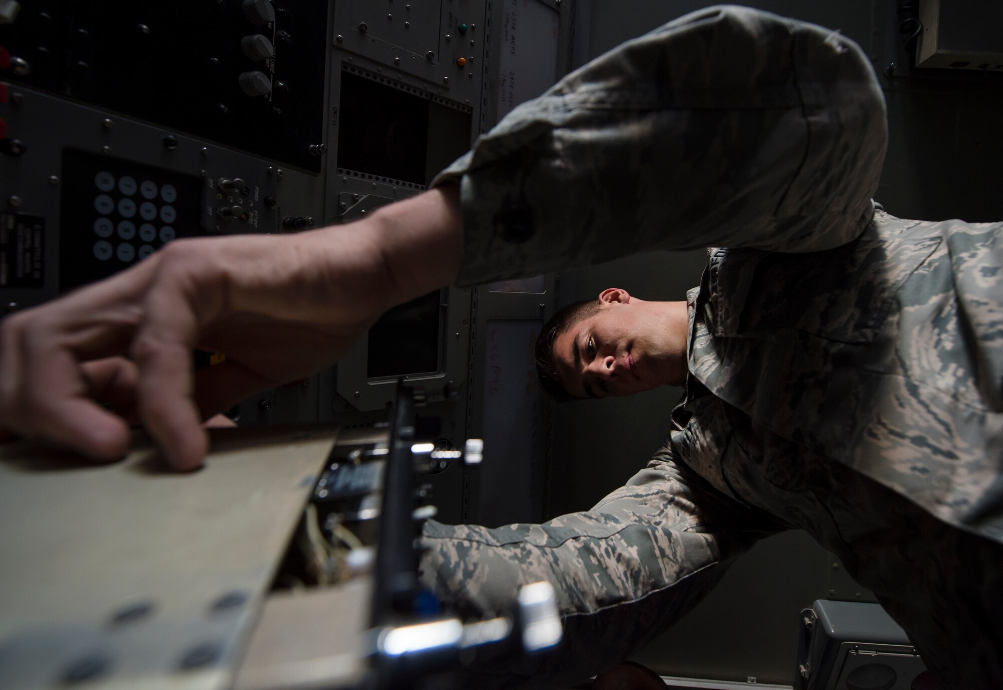 Senior Airman Collin Tully, 727th Expeditionary Air Control Squadron, Detachment 3 radar maintainer, conducts routine maintenance in the radar shelter of a transportable radar system (TPS-75) Jan. 14, 2019, at Al Udeid Air Base, Qatar. The 727th EACS consists of a team of 23 Airmen from seven different Air Force Specialty Codes. Together, they ensure TPS-75 radar systems are prepared to identify any aircraft within a 240 nautical mile range of Al Udeid. (U.S. Air Force Tech. Sgt. Christopher Hubenthal)