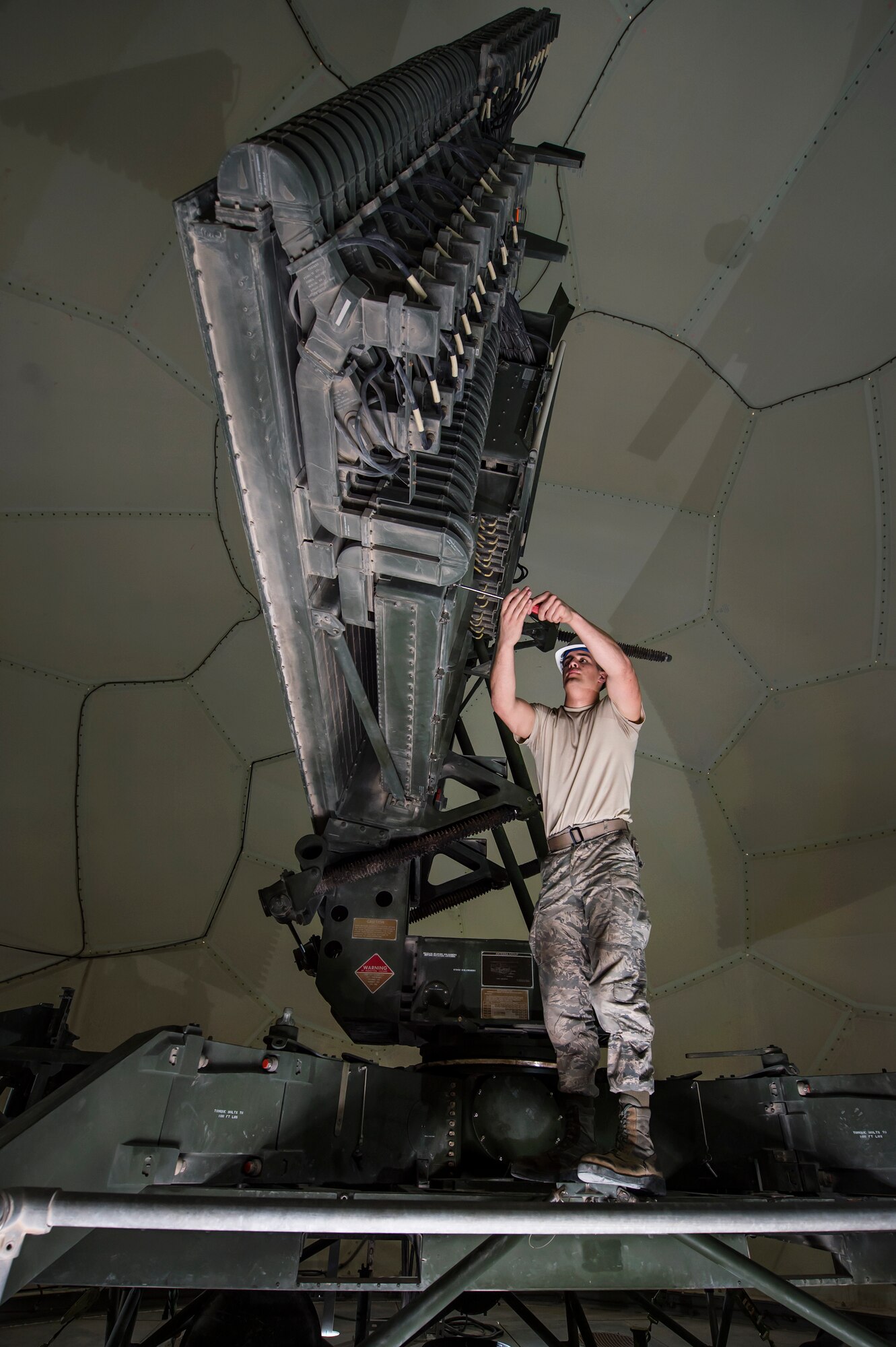 Senior Airman Collin Tully, 727th Expeditionary Air Control Squadron, Detachment 3 radar maintainer, conducts routine maintenance on a transportable radar system (TPS-75) Jan. 14, 2019, at Al Udeid Air Base, Qatar. The 727th EACS consists of a team of 23 Airmen from seven different Air Force Specialty Codes. Together, they ensure TPS-75 radar systems are prepared to identify any aircraft within a 240 nautical mile range of Al Udeid. (U.S. Air Force Tech. Sgt. Christopher Hubenthal)