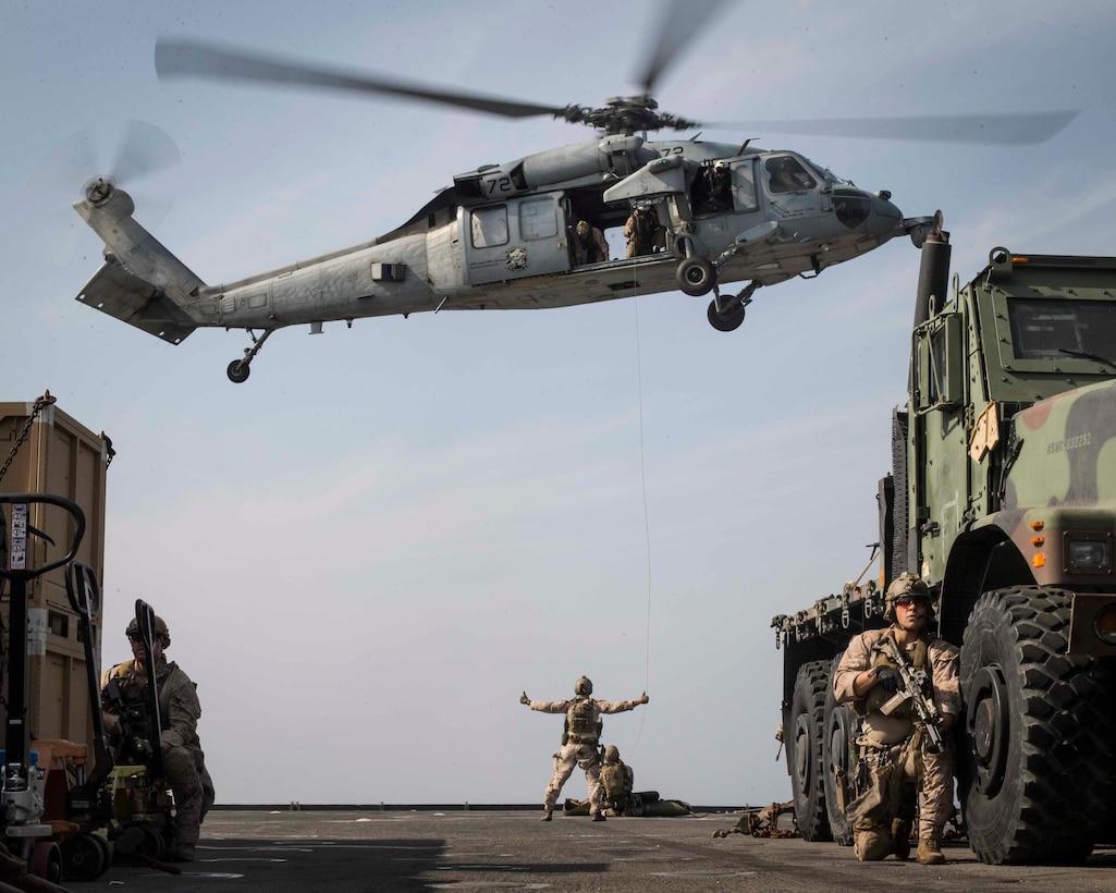U.S. Marines with the Maritime Raid Force, 13th Marine Expeditionary Unit, set up security and prepare the litter for extraction during a simulated visit, board, search and seizure mission aboard the Whidbey Island-class dock landing ship USS Rushmore on Jan. 15, 2019. The Essex Amphibious Ready Group and the 13th MEU are deployed to the U.S. 5th fleet area of operations in support of naval operations to ensure maritime stability and security in the Central Region, connecting the Mediterranean and the Pacific through the western Indian Ocean and three strategic choke points.