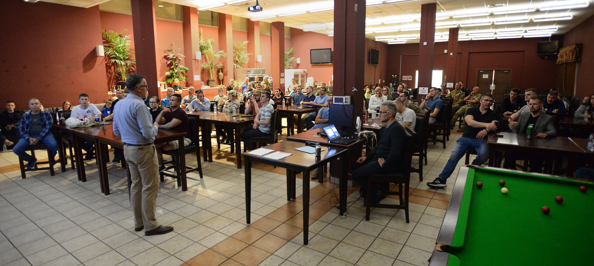 Royal Danish Air Force Lt. Col. Lars Cramer-Larsen, RDAF chief coalition strategist, provides a briefing at the Kasbah at Al Udeid Air Base, Qatar, Jan. 7, 2019. Cramer-Larsen worked at the Danish Defense College for nine years as an instructor where he began his strategic research on the Middle East prior to arriving at the Combined Air Operations Center. (U.S. Air Force Photo by Senior Airman Travis Beihl)