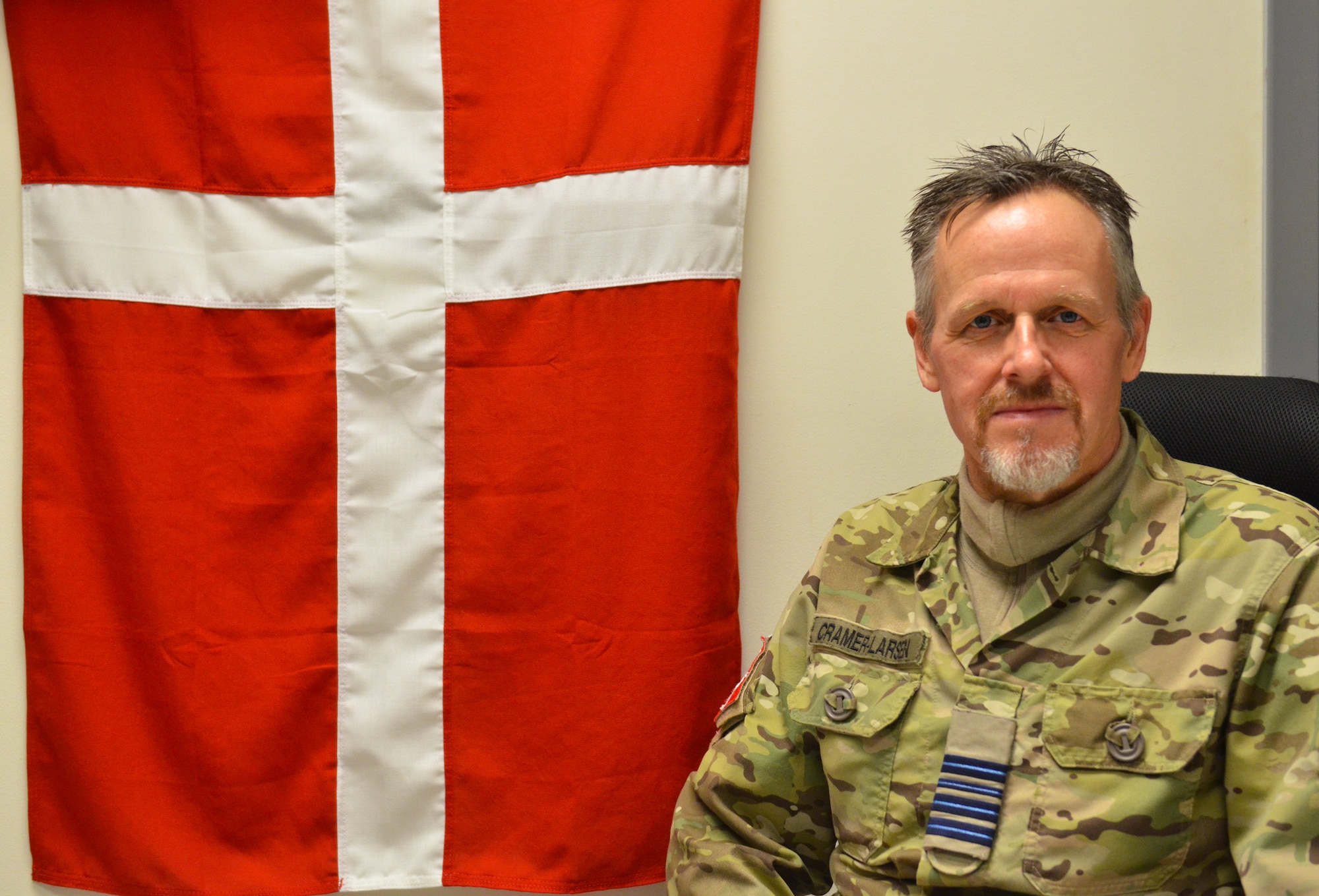Royal Danish Air Force Lt. Col. Lars Cramer-Larsen, RDAF chief coalition strategist, sits in his office in the Combined Air Operations Center  at Al Udeid Air Base, Qatar, Jan. 16, 2019. Cramer-Larsen has hosted several informal lectures about the Middle East throughout the base to provide his expertise and research to coalition audiences. (U.S. Air Force Photo by Senior Airman Travis Beihl)