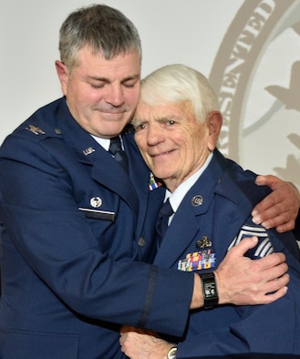 Col. Tim Lincoln, commander, 120th Mission Support Group, embraces his father, retired Chief Master Sgt. Joe Lincoln, during his promotion to colonel ceremony Jan. 4, 2019 here