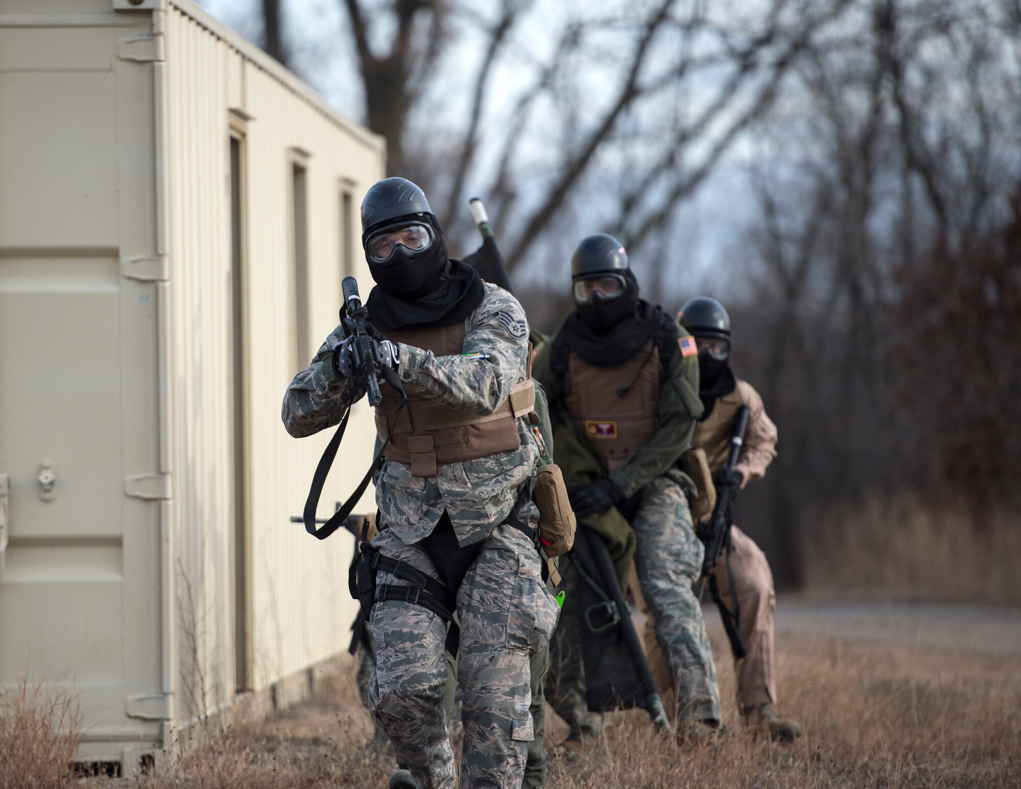 U.S. Air Force Airmen from the 109th Aeromedical Evacuation Squadron and the 133rd Medical Group practice basic room clearing techniques at the Arden Hills Army Training Site in Arden Hills, Minn., Nov. 16, 2018.
