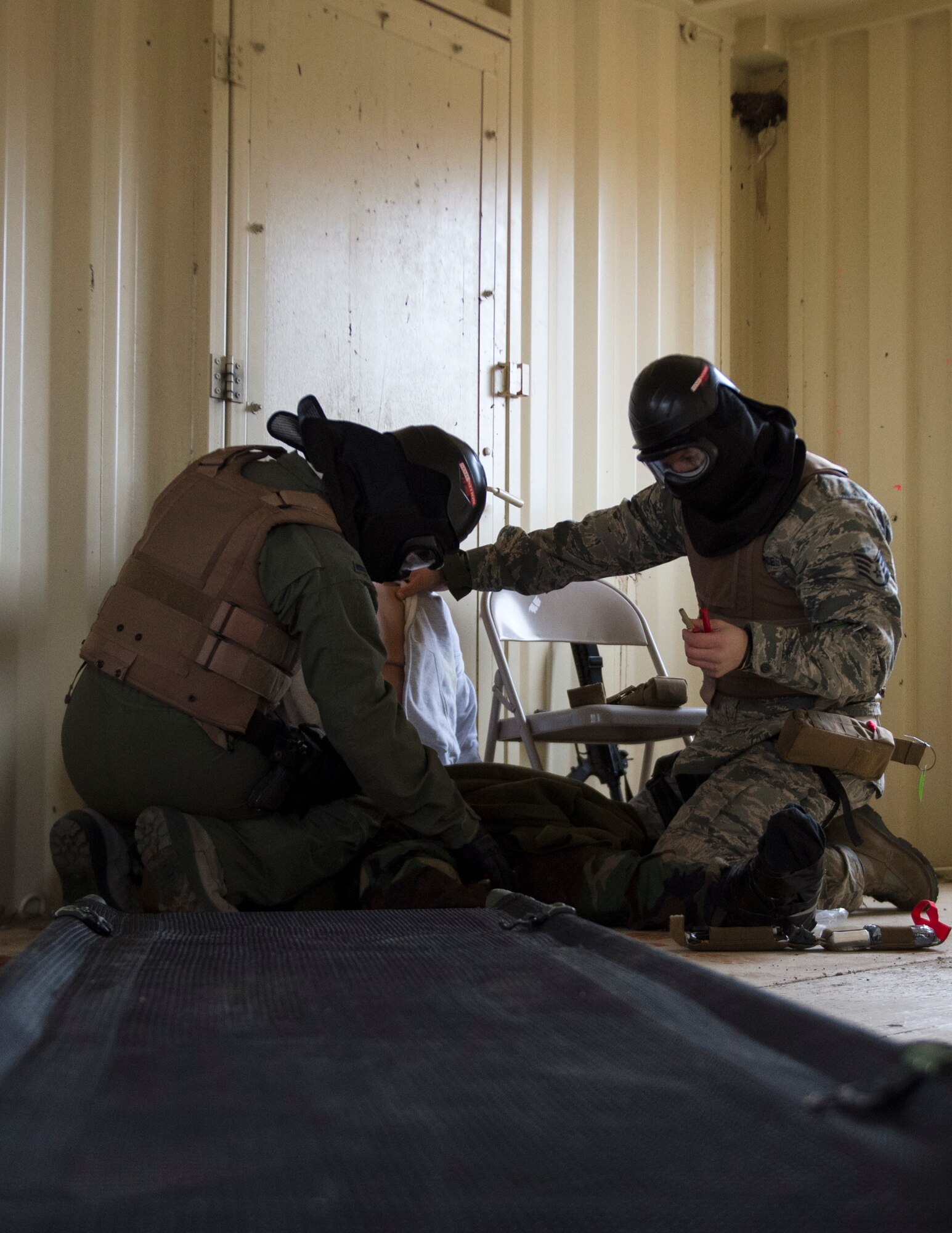 U.S. Air Force Airmen from the 109th Aeromedical Evacuation Squadron, check the simulated patient for additional injuries at the Arden Hills Army Training Site in Arden Hills, Minn., Nov. 16, 2018.