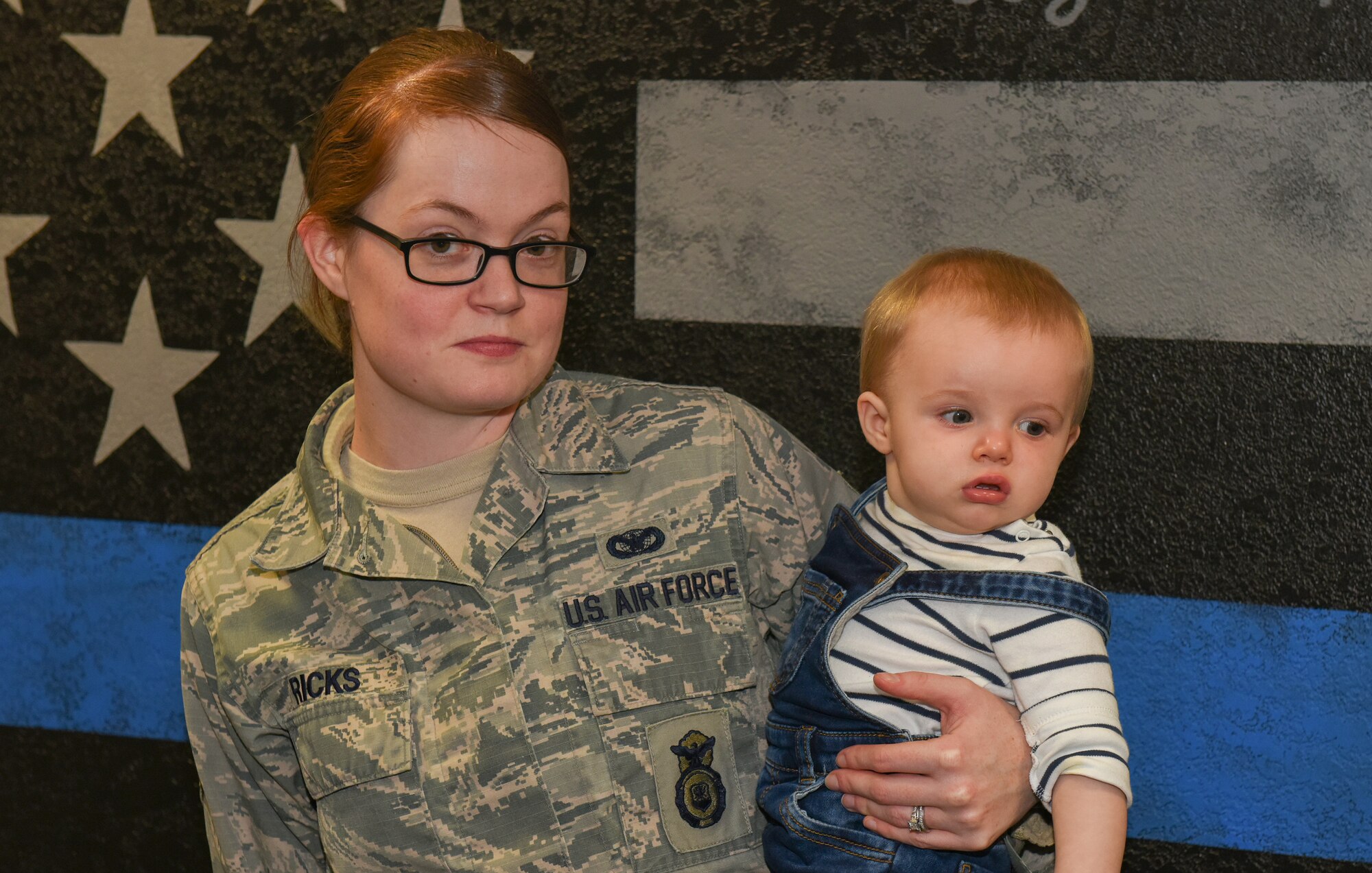 U.S. Air Force Senior Airman Heather Ricks, 423rd Security Forces commander secretary, holds her newborn baby at RAF Alconbury, United Kingdom, Jan. 15, 2019. (U.S. Air Force photo by Airman 1st Class Jennifer Zima)