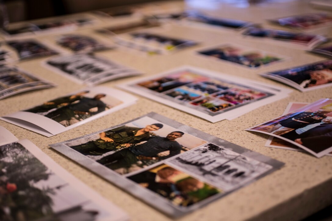 Photos belonging to retired Sgt. Maj. Edward F. Neas are spread out to be shared with fellow Vietnam War veterans and Marine Forces Reserve leaders in Edinburg, Texas, Jan. 14, 2019. The featured photo is of Sgt. Alfredo Cantu Gonzalez and Gunnery Sgt. John L. Canley during the Vietnam War. Dolia Gonzalez was presented the Medal of Honor awarded to her son, Sgt. Alfredo Cantu Gonzalez, October 1969. Canley was awarded the Medal of Honor, October 2018. (U.S. Marine Corps photo by Cpl. Tessa D. Watts)