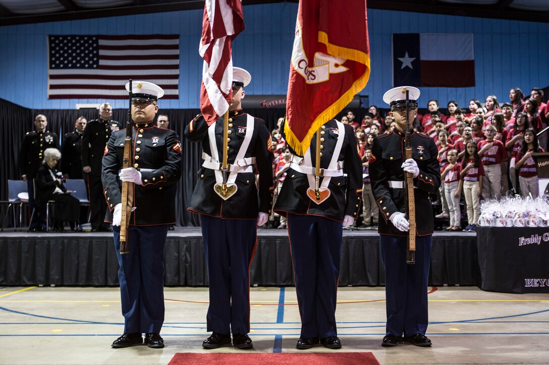 A color guard presents the colors during the Medal of Honor flag presentation ceremony at the Freddy Gonzalez Elementary school in Edinburg, Texas, Jan. 14, 2019. Dolia Gonzalez was presented the Medal of Honor flag on behalf of her son, Sgt. Alfredo Cantu Gonzalez, Jan. 14, 2019. (U.S. Marine Corps photo by Cpl. Tessa D. Watts)